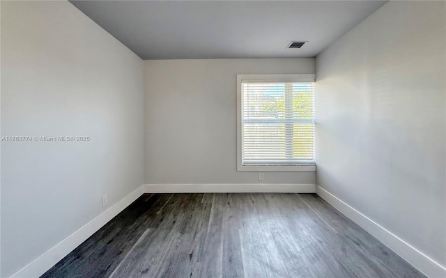 1770 E Las Olas Blvd Unit 302, Fort Lauderdale, FL 33301 - unfurnished room with dark wood-style floors and baseboards