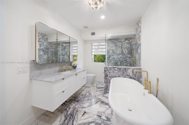 full bath featuring toilet, vanity, marble finish floor, visible vents, and a freestanding bath