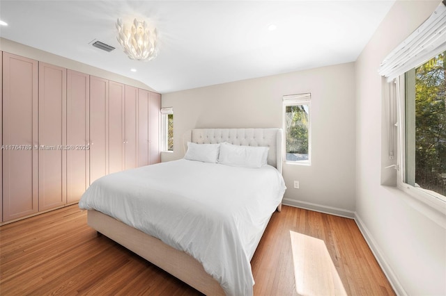 bedroom with light wood-type flooring, recessed lighting, baseboards, and visible vents