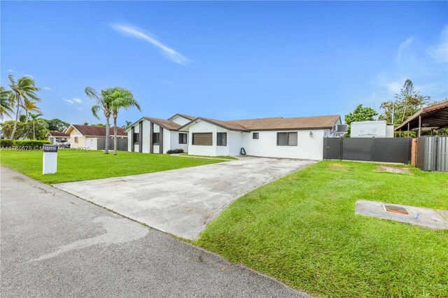 18650 SW 127th Ct, Miami, FL 33177 - view of front facade with stucco siding and driveway