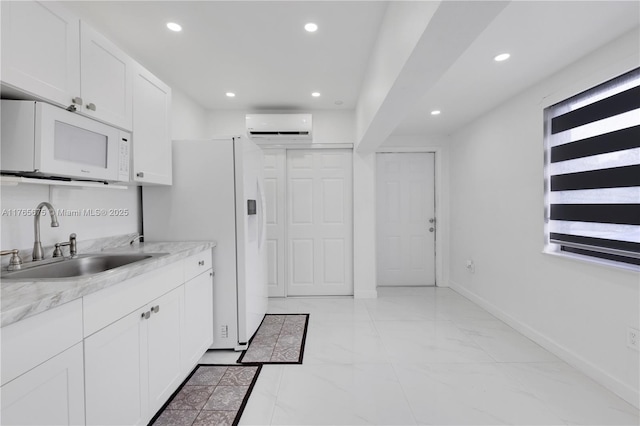 18650 SW 127th Ct, Miami, FL 33177 - kitchen with white appliances, an AC wall unit, white cabinets, recessed lighting, and light countertops
