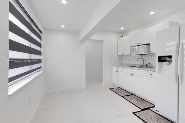 18650 SW 127th Ct, Miami, FL 33177 - kitchen featuring white appliances, white cabinets, recessed lighting, and light marble finish flooring