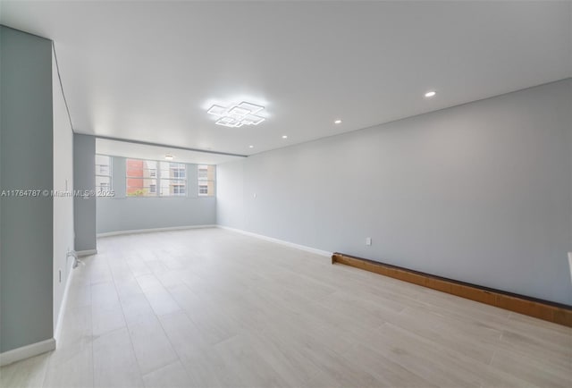 1710 NE 191st St Unit 315-3, Miami, FL 33179 - unfurnished room featuring recessed lighting, light wood-style flooring, and baseboards