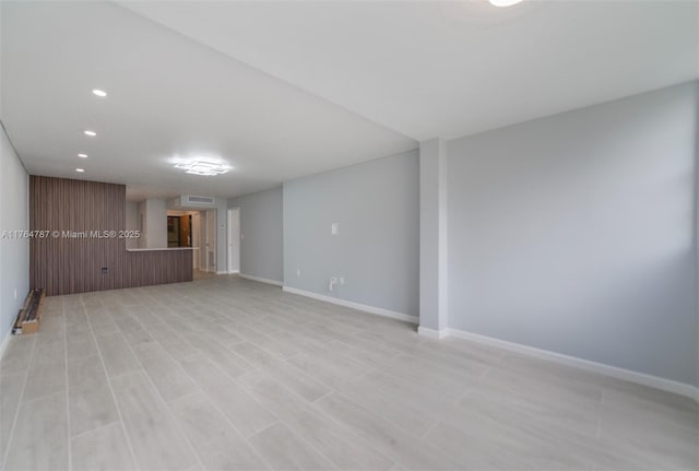 1710 NE 191st St Unit 315-3, Miami, FL 33179 - unfurnished living room with recessed lighting, light wood-type flooring, baseboards, and visible vents
