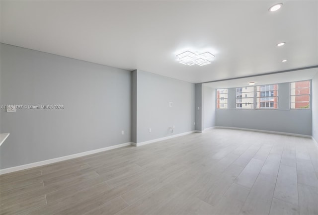 1710 NE 191st St Unit 315-3, Miami, FL 33179 - empty room with recessed lighting, baseboards, and light wood-style floors