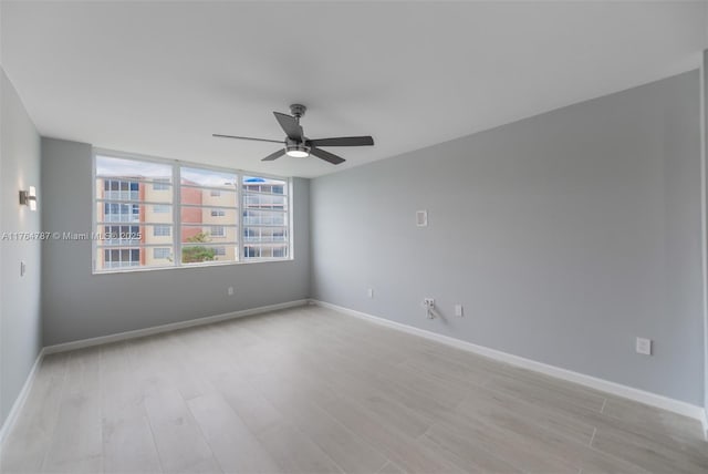 1710 NE 191st St Unit 315-3, Miami, FL 33179 - spare room with baseboards, light wood-type flooring, and ceiling fan