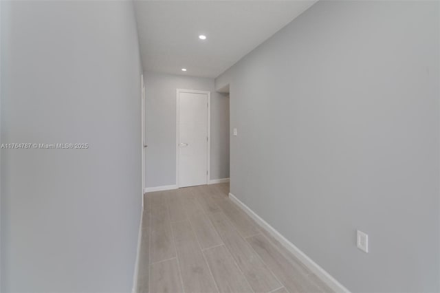 1710 NE 191st St Unit 315-3, Miami, FL 33179 - hall featuring recessed lighting, baseboards, and light wood-style floors
