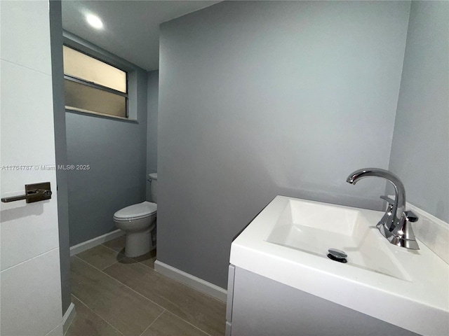 1710 NE 191st St Unit 315-3, Miami, FL 33179 - bathroom featuring tile patterned flooring, toilet, baseboards, and a sink