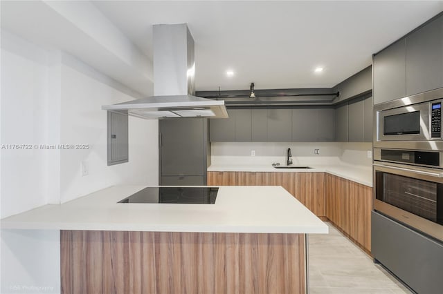 1000 Quayside Ter Unit 903, Miami, FL 33138 - kitchen featuring appliances with stainless steel finishes, a peninsula, island range hood, modern cabinets, and a sink