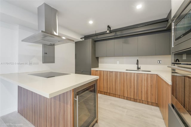 1000 Quayside Ter Unit 903, Miami, FL 33138 - kitchen featuring modern cabinets, wine cooler, island exhaust hood, and appliances with stainless steel finishes