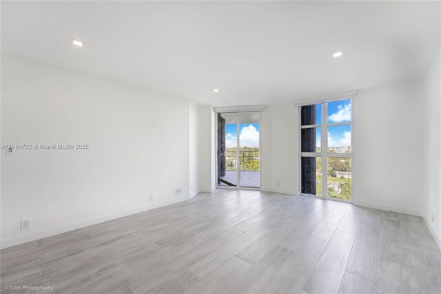 1000 Quayside Ter Unit 903, Miami, FL 33138 - unfurnished room with light wood finished floors, recessed lighting, floor to ceiling windows, and baseboards