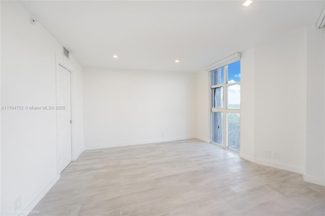 1000 Quayside Ter Unit 903, Miami, FL 33138 - spare room with light wood-type flooring, visible vents, baseboards, and recessed lighting