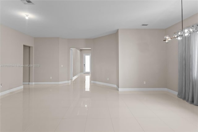 unfurnished room featuring baseboards, light tile patterned flooring, and visible vents
