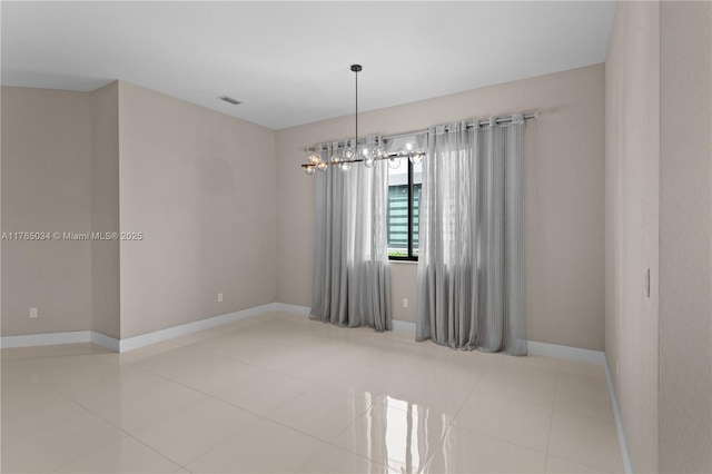 tiled spare room with baseboards, a notable chandelier, and visible vents