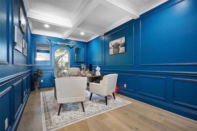 home office with crown molding, beam ceiling, wood finished floors, a decorative wall, and recessed lighting