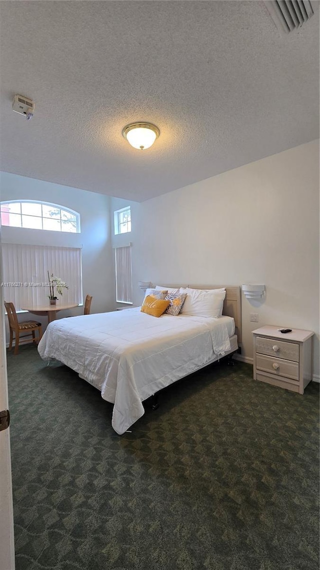 1013 Park Ridge Cir, Kissimmee, FL 34746 - carpeted bedroom with visible vents and a textured ceiling