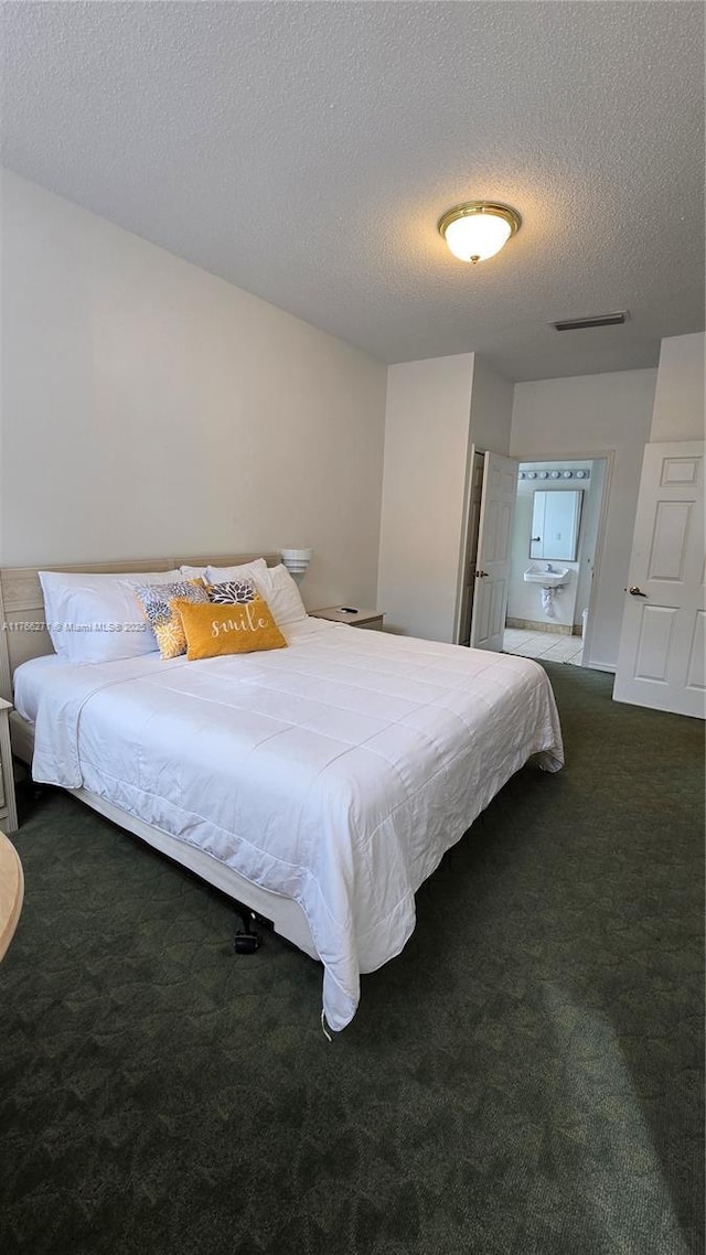 1013 Park Ridge Cir, Kissimmee, FL 34746 - carpeted bedroom with visible vents and a textured ceiling