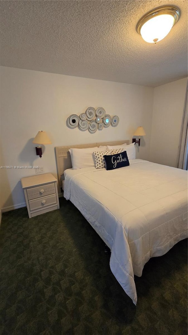 1013 Park Ridge Cir, Kissimmee, FL 34746 - bedroom featuring dark carpet and a textured ceiling