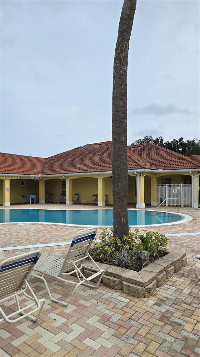 1013 Park Ridge Cir, Kissimmee, FL 34746 - pool featuring a patio area and fence