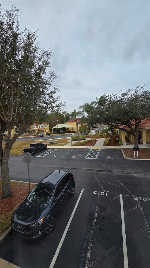1013 Park Ridge Cir, Kissimmee, FL 34746 - view of uncovered parking lot