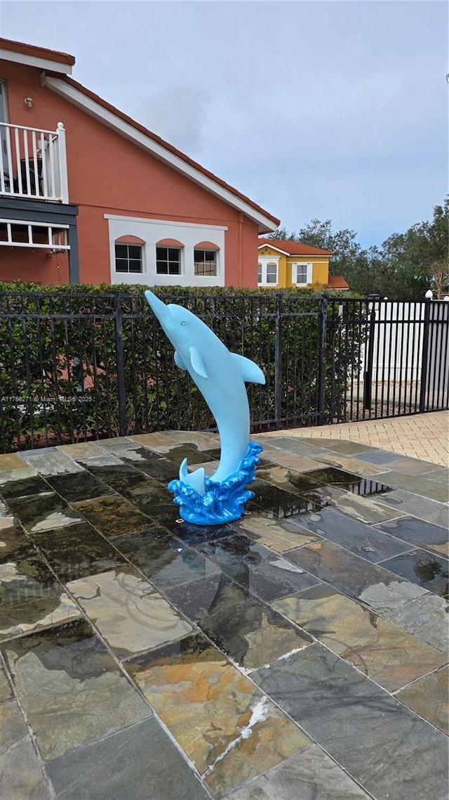 1013 Park Ridge Cir, Kissimmee, FL 34746 - view of patio featuring a balcony and fence