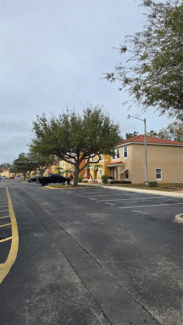 1013 Park Ridge Cir, Kissimmee, FL 34746 - view of road featuring curbs, sidewalks, and street lighting