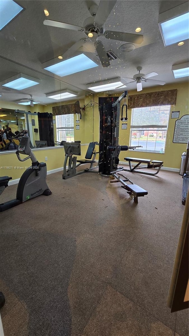 1013 Park Ridge Cir, Kissimmee, FL 34746 - exercise room featuring visible vents, baseboards, and ceiling fan