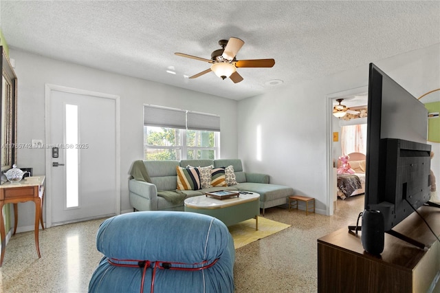 5233 NE 4th Ave, Oakland Park, FL 33334 - living room with ceiling fan, speckled floor, and a textured ceiling