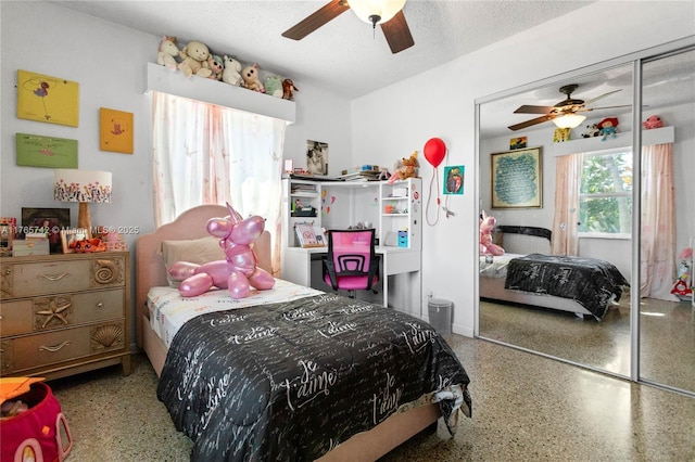 5233 NE 4th Ave, Oakland Park, FL 33334 - bedroom featuring a closet, a textured ceiling, speckled floor, and ceiling fan