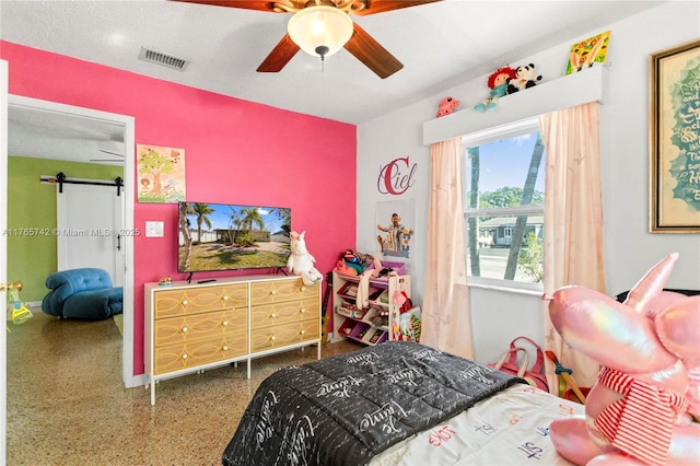 5233 NE 4th Ave, Oakland Park, FL 33334 - bedroom featuring a textured ceiling, visible vents, speckled floor, a ceiling fan, and a barn door