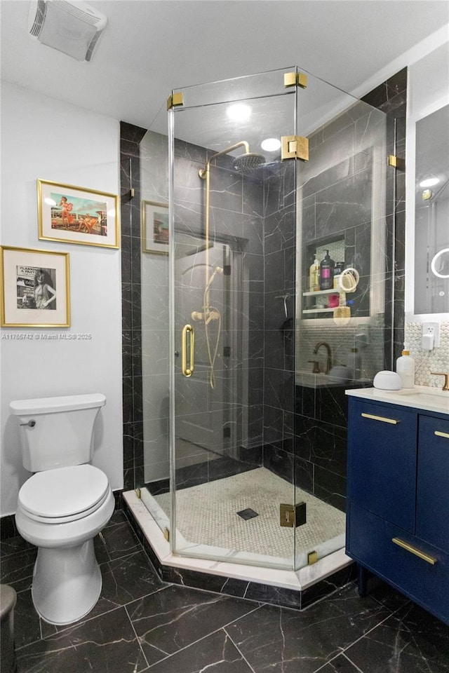 5233 NE 4th Ave, Oakland Park, FL 33334 - full bathroom with marble finish floor, a shower stall, toilet, and visible vents