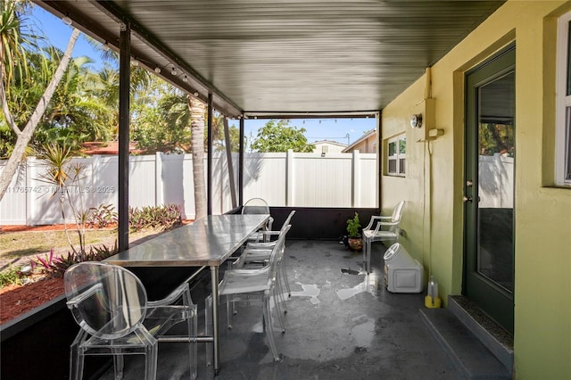 5233 NE 4th Ave, Oakland Park, FL 33334 - unfurnished sunroom featuring outdoor dining space