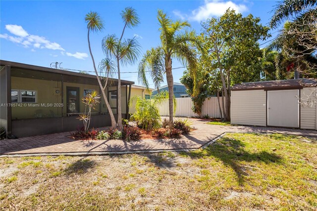 5233 NE 4th Ave, Oakland Park, FL 33334 - view of yard with an outdoor structure, a shed, and fence