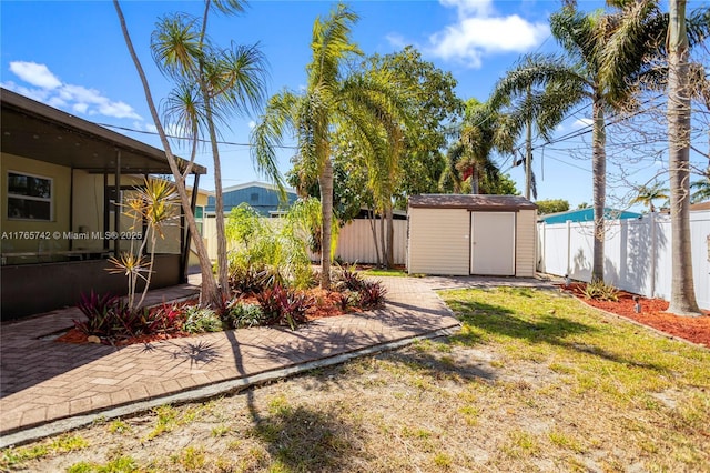 5233 NE 4th Ave, Oakland Park, FL 33334 - view of yard with a fenced backyard, an outbuilding, and a storage shed