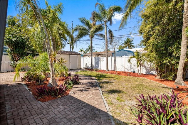 5233 NE 4th Ave, Oakland Park, FL 33334 - view of yard with a fenced backyard, a shed, and an outdoor structure