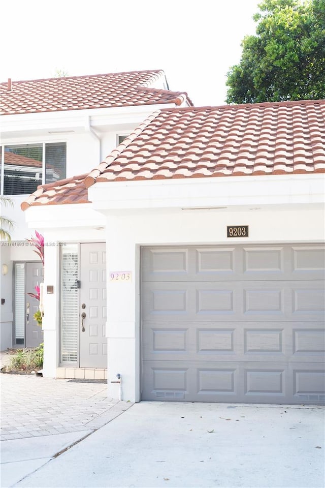 9203 NW 9th Ct, Plantation, FL 33324 - garage with concrete driveway