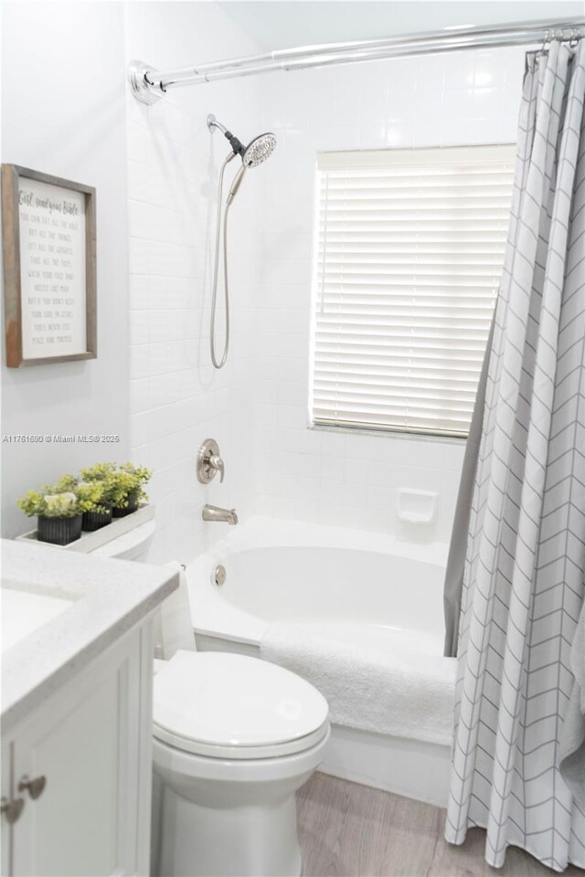 9203 NW 9th Ct, Plantation, FL 33324 - bathroom featuring shower / bath combo with shower curtain, toilet, and vanity