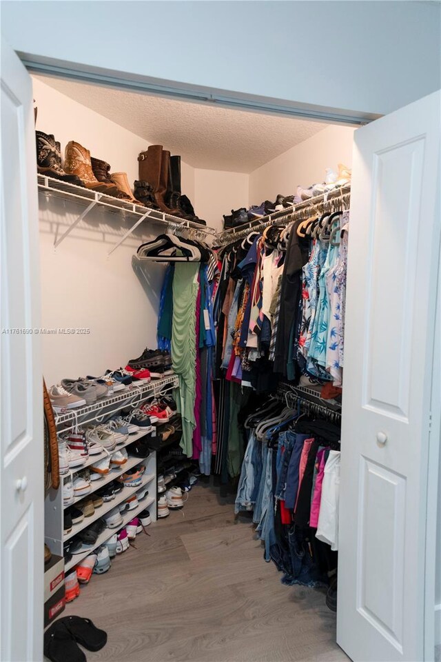 9203 NW 9th Ct, Plantation, FL 33324 - spacious closet featuring wood finished floors
