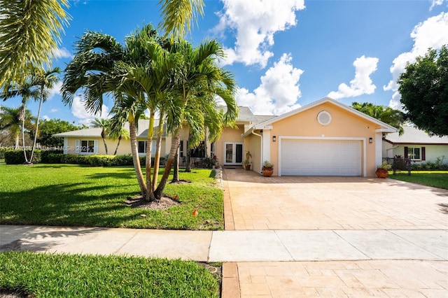 311 NW 197th Ave, Pembroke Pines, FL 33029 - single story home featuring a garage, a front yard, decorative driveway, and stucco siding