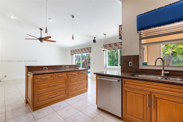 311 NW 197th Ave, Pembroke Pines, FL 33029 - kitchen featuring stainless steel dishwasher, a sink, a ceiling fan, brown cabinets, and light tile patterned floors