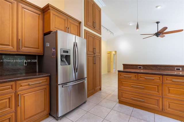 311 NW 197th Ave, Pembroke Pines, FL 33029 - kitchen with vaulted ceiling, tasteful backsplash, brown cabinetry, ceiling fan, and stainless steel refrigerator with ice dispenser