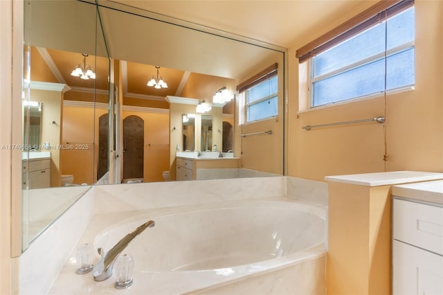 311 NW 197th Ave, Pembroke Pines, FL 33029 - bathroom featuring toilet, crown molding, vanity, and a garden tub