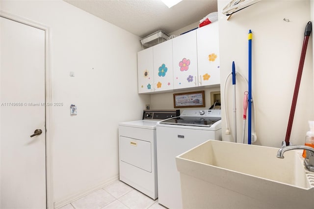 311 NW 197th Ave, Pembroke Pines, FL 33029 - laundry room with washing machine and clothes dryer, a sink, a textured ceiling, light tile patterned flooring, and cabinet space
