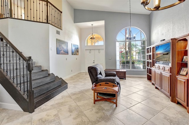 15852 SW 14th St, Pembroke Pines, FL 33027 - foyer entrance featuring a chandelier, stairs, high vaulted ceiling, and light tile patterned flooring