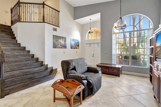 15852 SW 14th St, Pembroke Pines, FL 33027 - entryway with a towering ceiling, light tile patterned flooring, and stairway