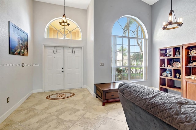 15852 SW 14th St, Pembroke Pines, FL 33027 - entrance foyer with a high ceiling, plenty of natural light, and a chandelier