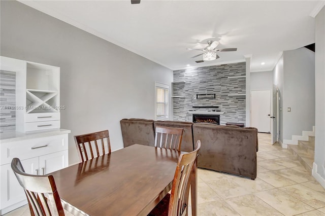 15852 SW 14th St, Pembroke Pines, FL 33027 - dining area featuring ceiling fan, crown molding, a fireplace, and light tile patterned floors