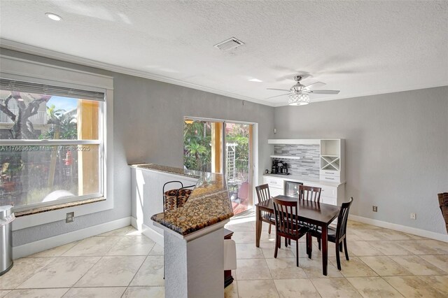 15852 SW 14th St, Pembroke Pines, FL 33027 - dining area with a ceiling fan, a textured ceiling, and crown molding