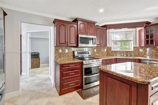 15852 SW 14th St, Pembroke Pines, FL 33027 - kitchen featuring appliances with stainless steel finishes, dark brown cabinets, ornamental molding, tasteful backsplash, and stone counters