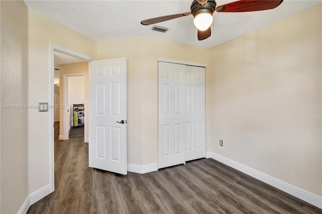 15852 SW 14th St, Pembroke Pines, FL 33027 - unfurnished bedroom with dark wood-style flooring, a closet, and a ceiling fan